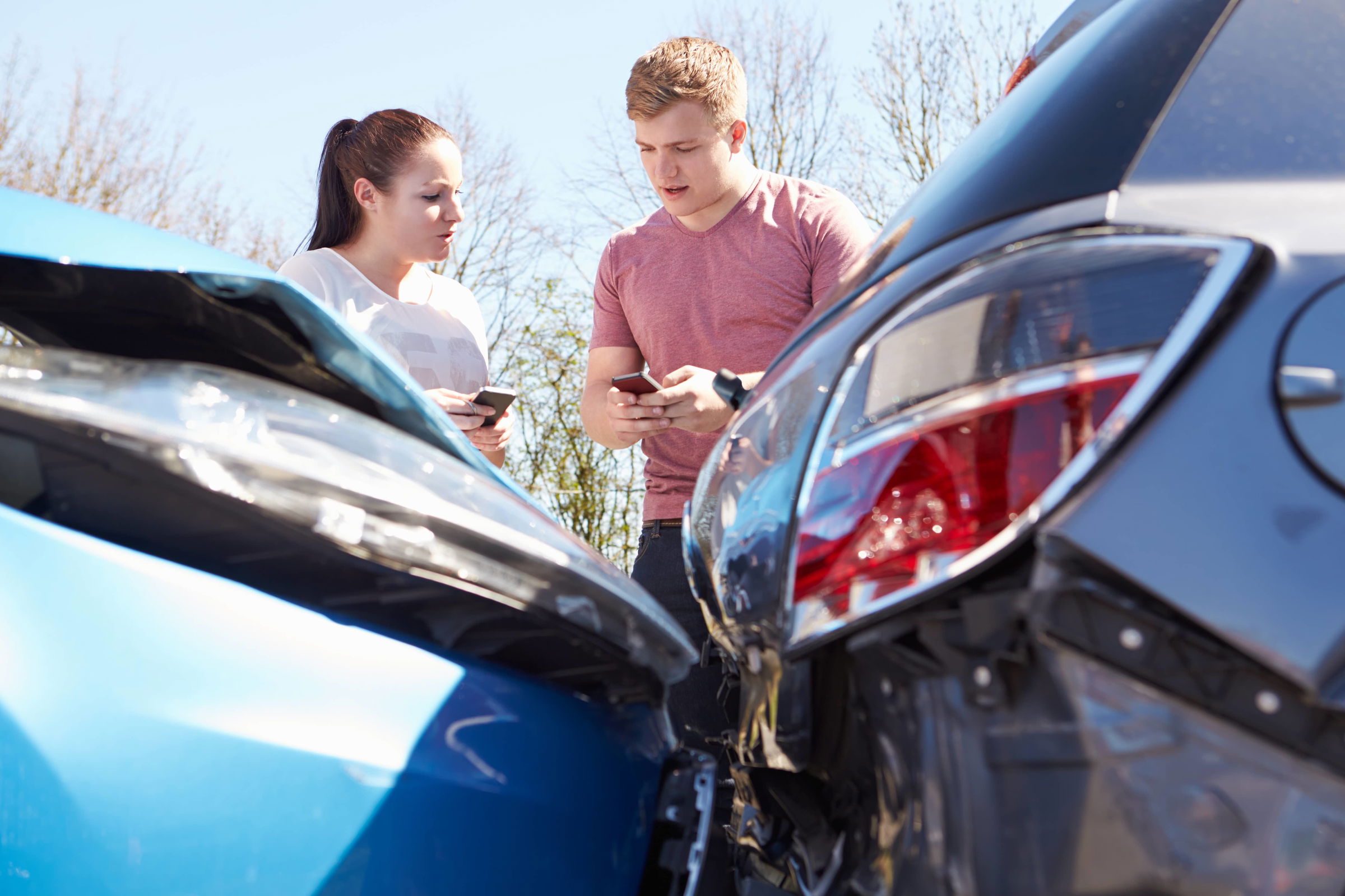 Two Drivers Exchange Insurance Details After Accident Two Drivers Exchange Insurance Details After Accident